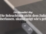 Geblurrte Schreibtischplatte, ukamo-Blog-Titel: Der Büromöbel-Blog. Die Beleuchtung nicht dem Zufall überlassen. ukamo zeigt wie's geht.